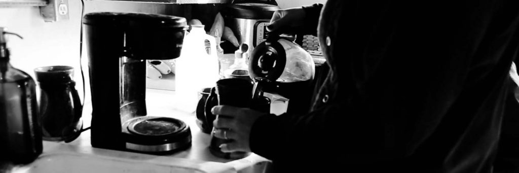 Mackenzie pouring coffee before starting the day