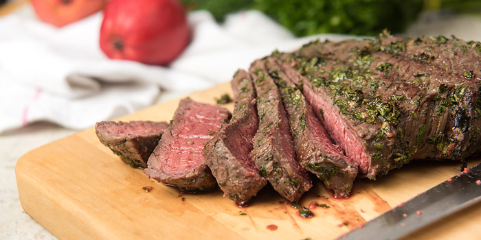 Medium-rare London Broil Sliced On Cutting Board