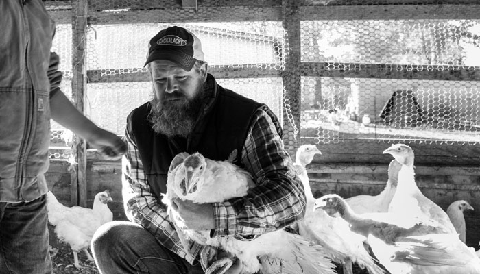 Tucker Withington holding a turkey