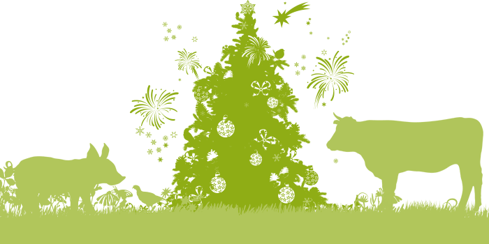 Green illustration of a pig, cow, and bird gathered around a Christmas tree