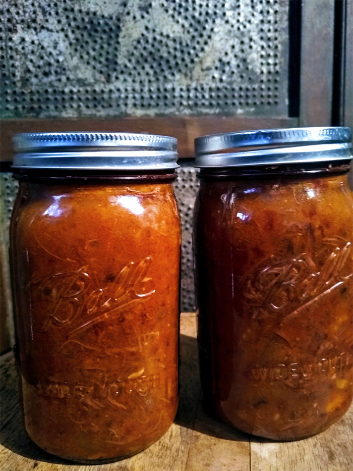 2 cans Roasted Beef Heart Chili on table