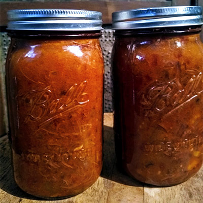 2 cans Roasted Beef Heart Chili on table