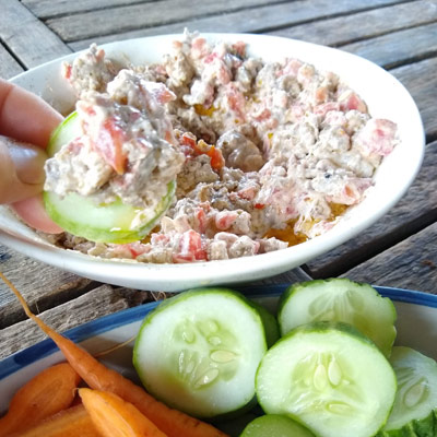 Sausage Dip in bowl with cucumber