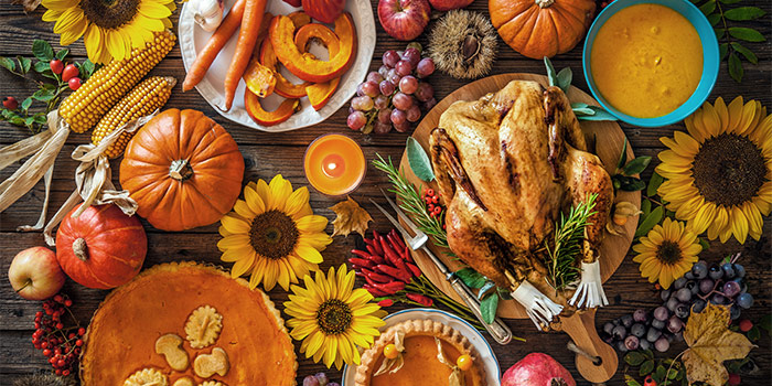 Photo Of Cooked Turkey With Various Foods And Flowers